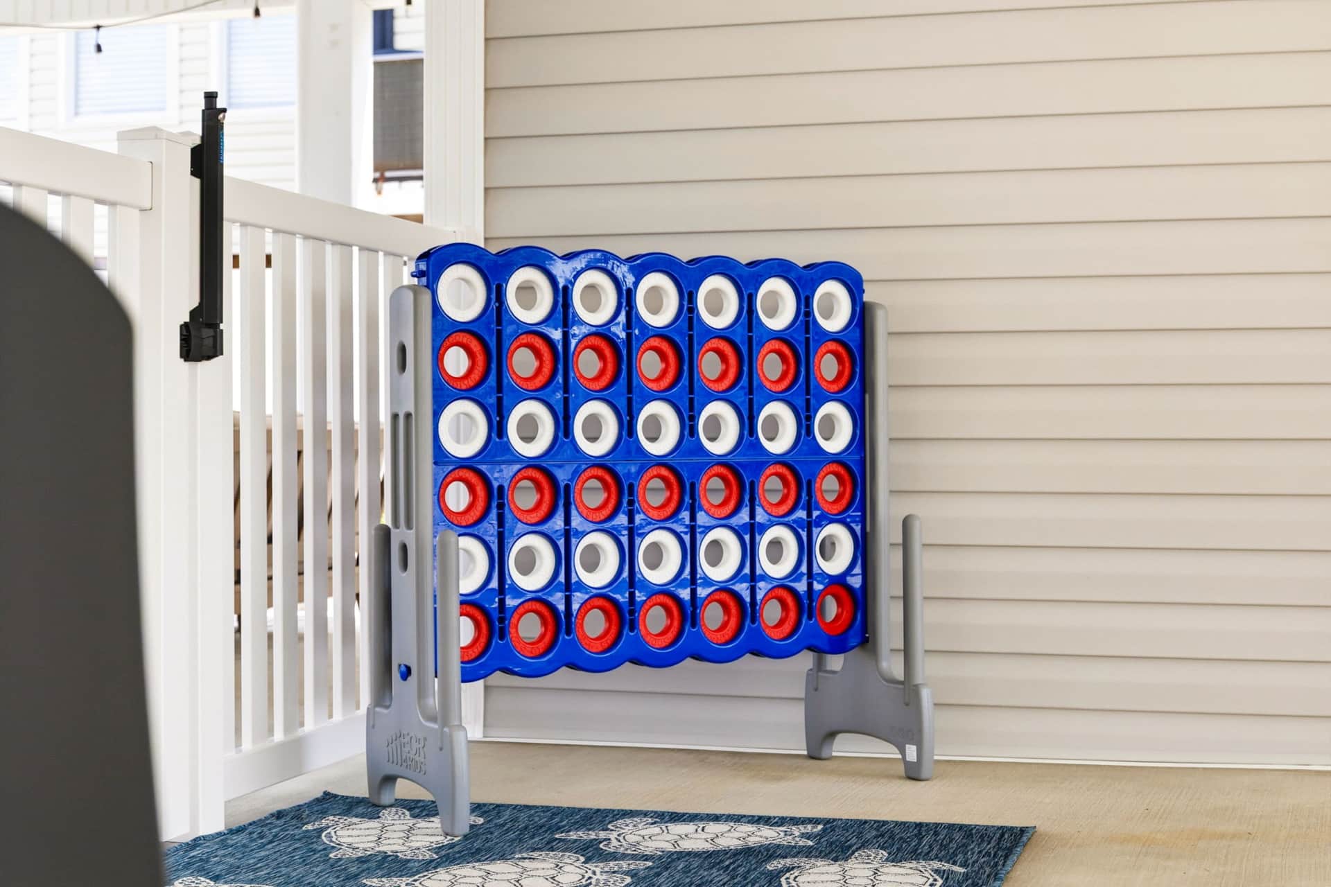 Giant Connect Four game beneath the covered patio