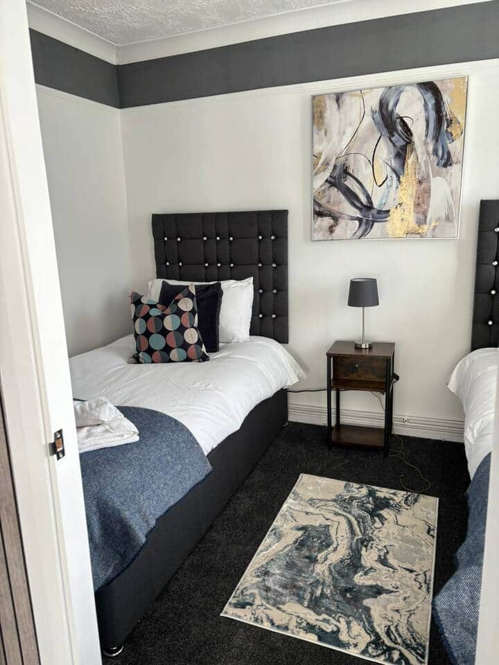 Unwind in our cozy and comfortable bedroom, perfect for a restful night's sleep. Book your stay now!