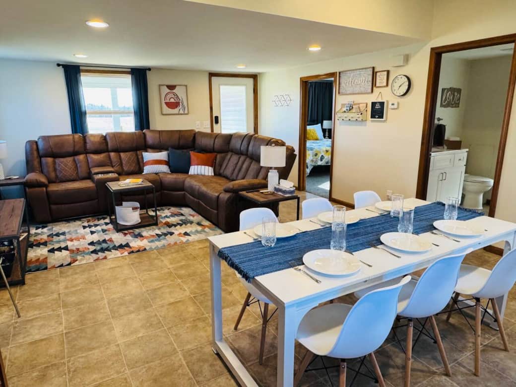 The dining area is right next to the living room in an open concept space. 