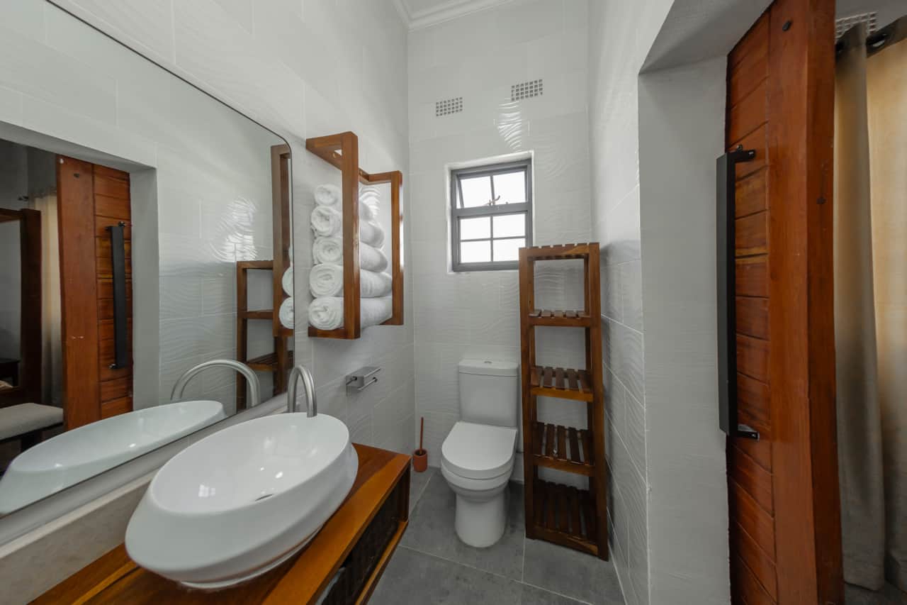 Modern bathroom with vanity, toilet and shower