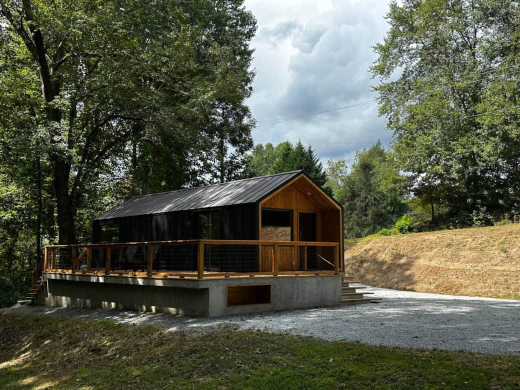 Spacious outdoor living with a large wrap-around deck surrounded by trees and privacy. Spacious outdoor living with a large wrap-around deck surrounded by trees and privacy.