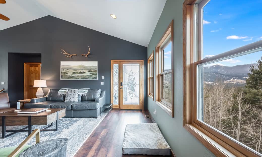 As you enter the front door, you'll be greeted with expansive windows showcasing sweeping mountains!