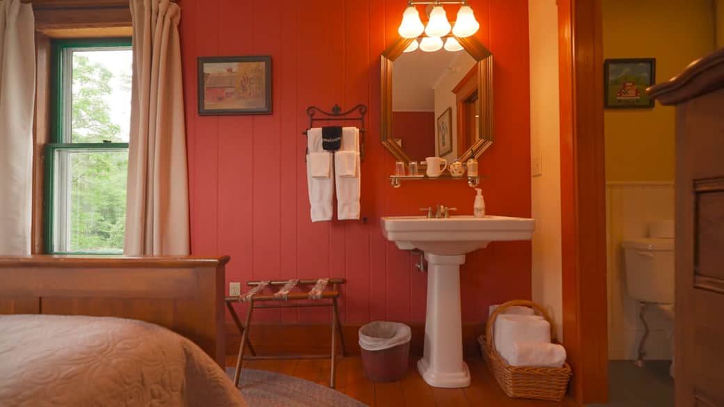 Private bathroom with shower and hand-made tile details, blending comfort with craftsmanship. Private bathroom with shower and hand-made tile details, blending comfort with craftsmanship.