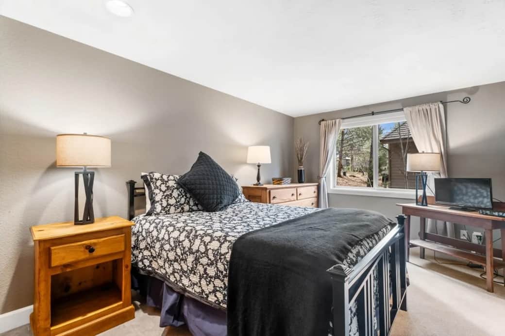 Downstairs queen bed with ensuite full bathroom