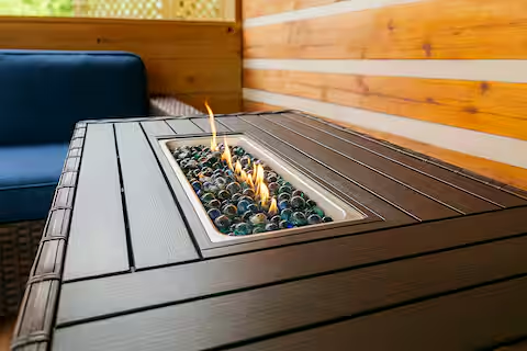 A glowing fire table sets the mood for cozy evenings at A Peaceful Retreat
