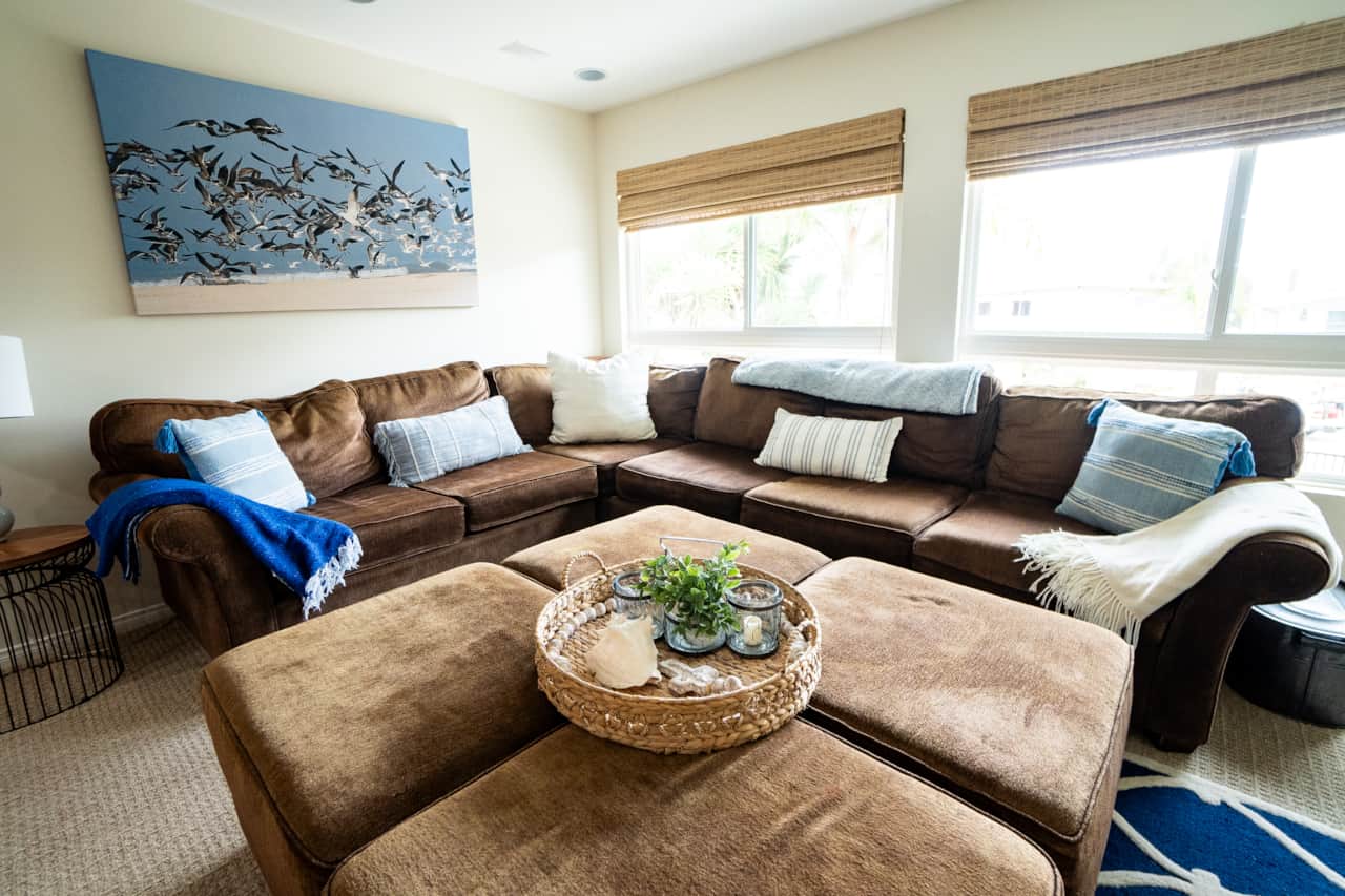 Deep cushions and cozy throws on the L-shaped couch