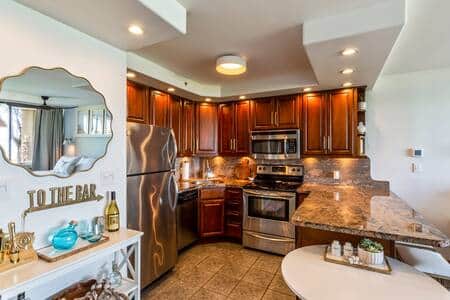 Inside dining table along with granite island for eating options for guests. 