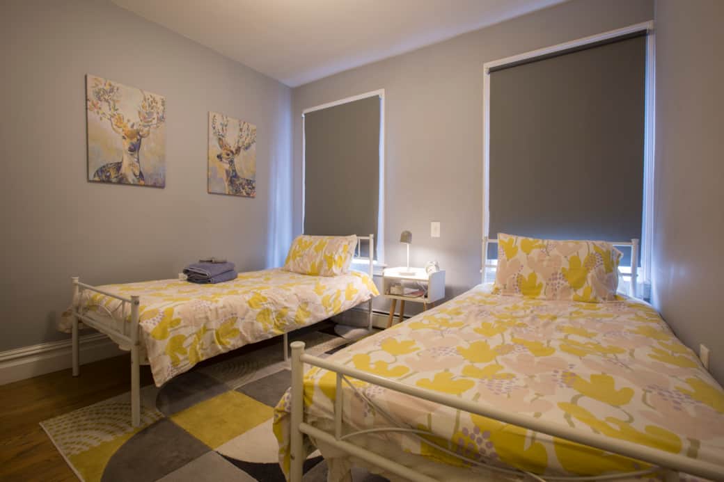 The front bedroom has two twin beds