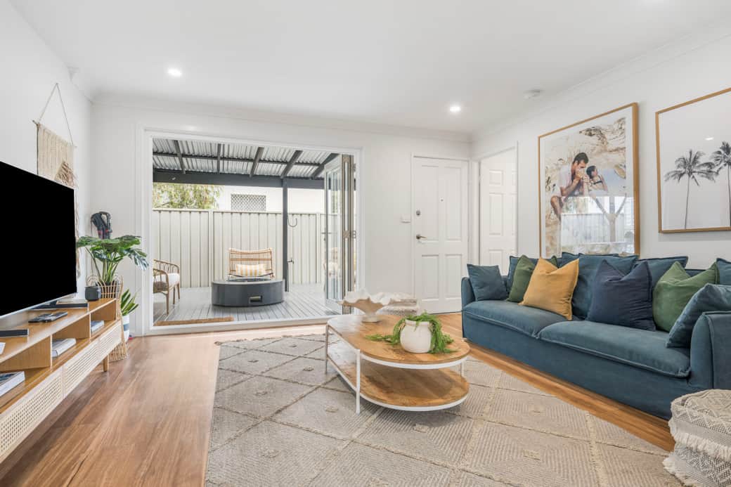 Main lounge flowing to outdoor entertainment area & gas firepit