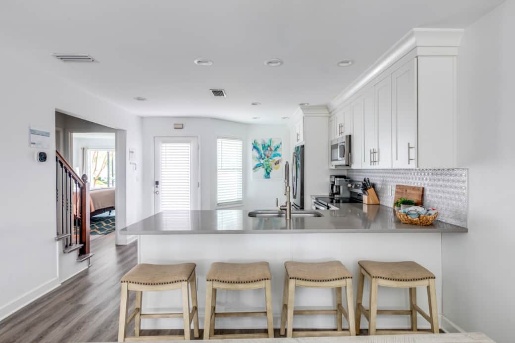 The kitchen overlooks the dining area and living room, great for entertaining! The kitchen overlooks the dining area and living room, great for entertaining!