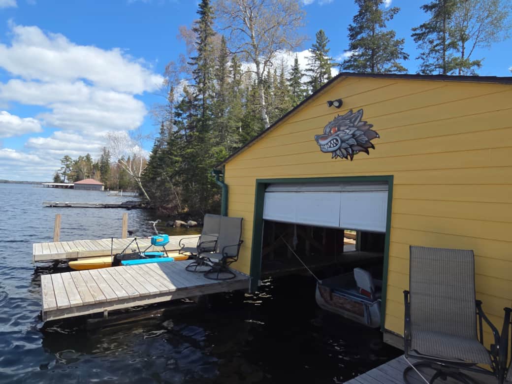 The property is easy to find by water, just look for our signature yellow boathouse with the wolf