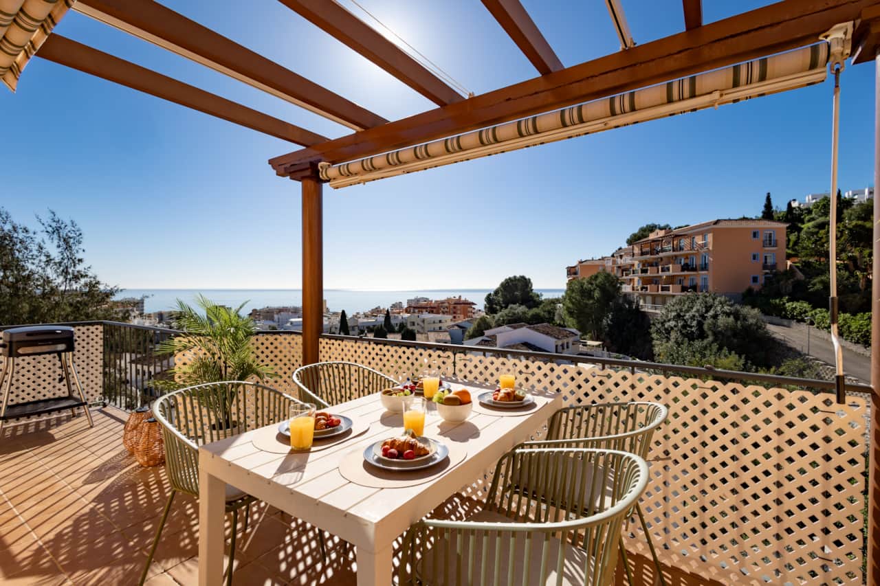 Terrace dining area with awning