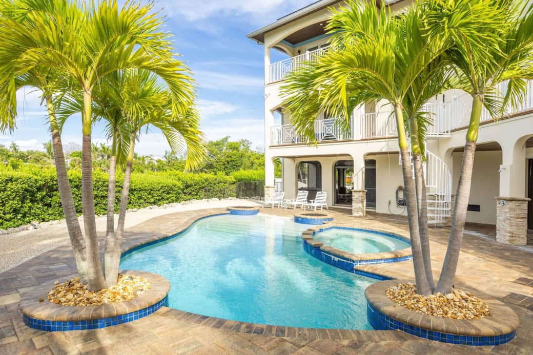 Canal front luxury private resort home with beach-entry pool and spa