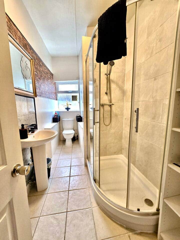 A bathroom has a hairdryer, iron and ironing board, a storage unit with shelves, clothes drying rack, toilet tissue, hand soap, shower gel, shampoo, and conditioner provided. Cleaning products included, also over door hook for towels A bathroom has a hairdryer, iron and ironing board, a storage unit with shelves, clothes drying rack, toilet tissue, hand soap, shower gel, shampoo, and conditioner provided. Cleaning products included, also over door hook for towels