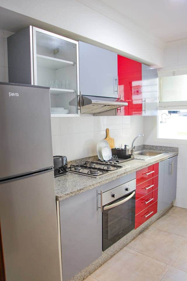 The fully equipped kitchen with granite countertops is ready for your MasterChef skills.