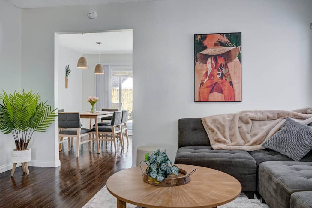 Living Room with artistic decor and dreamy couch with lots of pillows.