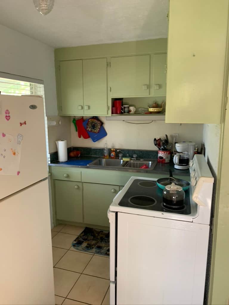 Original Unit 2 kitchen at Casa Citron showing an outdated layout with restricted circulation prior to renovation and modernization.