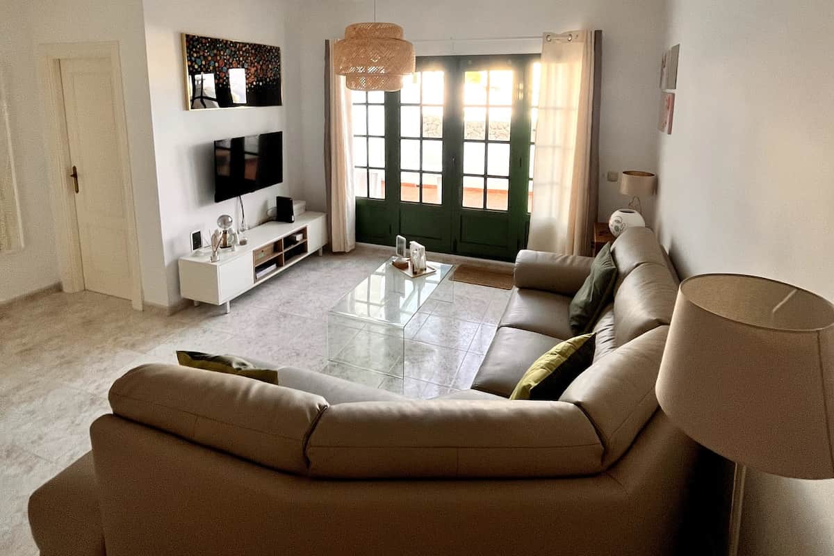 Bright, comfortable living space to relax after a day at the beach.