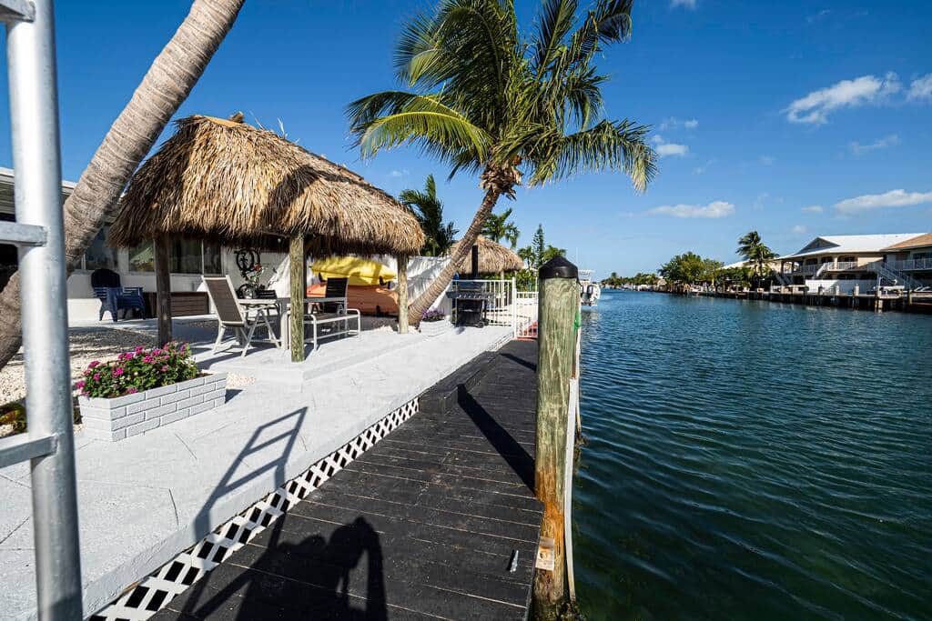 Backyard - Step off your own 37.5 foot dock into a wide canal with open water in both directions, th