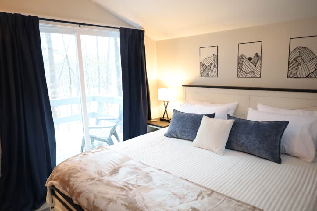 Peaceful primary bedroom with a king bed, soft lighting, and a calm, restful feel. Peaceful primary bedroom with a king bed, soft lighting, and a calm, restful feel.