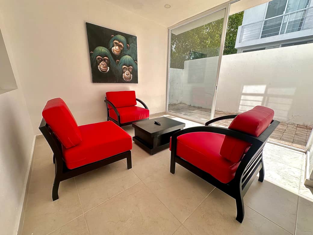 Open living space: living room, kitchen, dining area and patio 