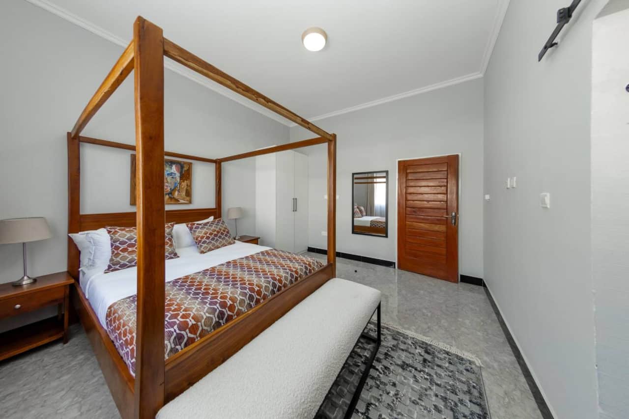Bedroom with canopy bed and en-suite bathroom 