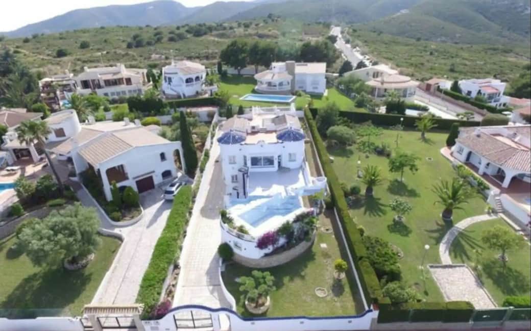 Aerial view of Villa The Deck — luxury hillside villa with panoramic sea and mountain scenery Aerial view of Villa The Deck — luxury hillside villa with panoramic sea and mountain scenery