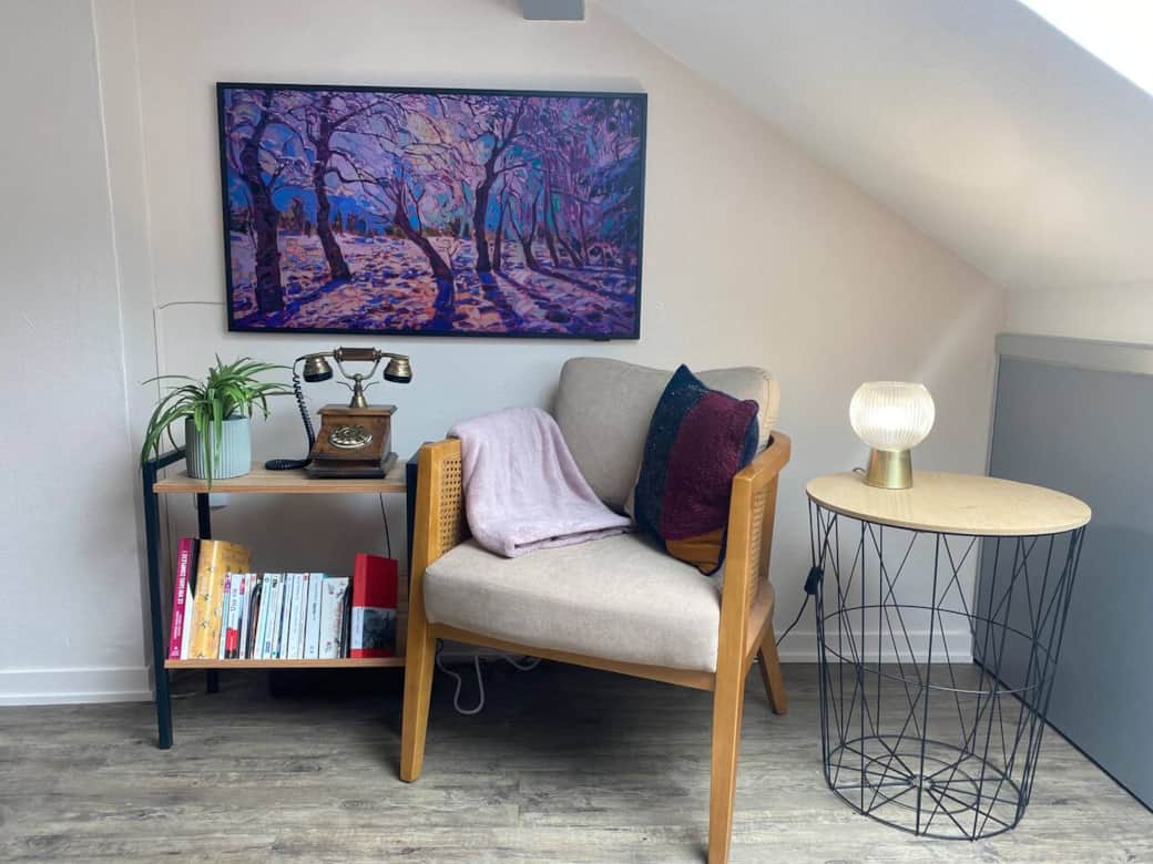 Curl up with a book in a serene reading nook in your Annecy apartment Curl up with a book in a serene reading nook in your Annecy apartment