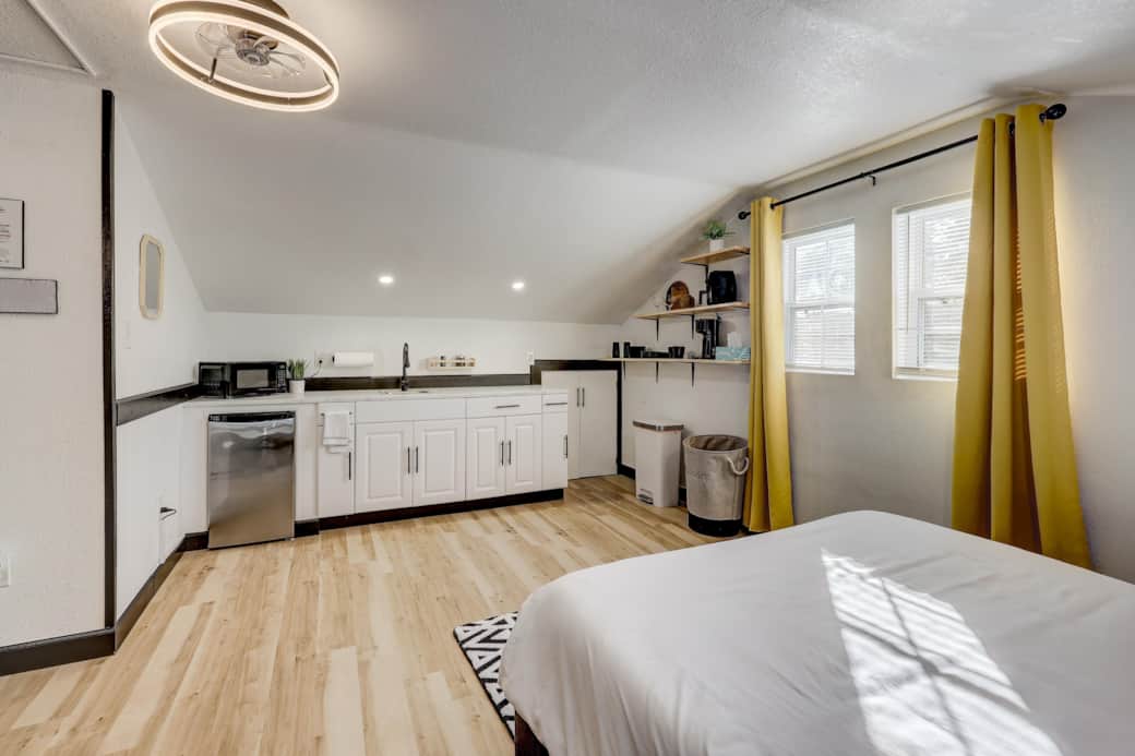 This cute kitchenette boasts a microwave, air fryer, coffee pot, mini fridge and sink. This cute kitchenette boasts a microwave, air fryer, coffee pot, mini fridge and sink.