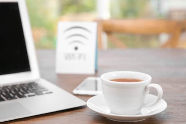 A laptop and a cup of tea, ready for a work stay