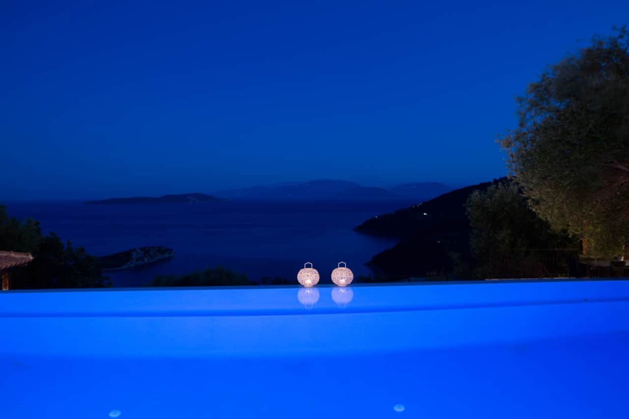 Pool with sea view in night