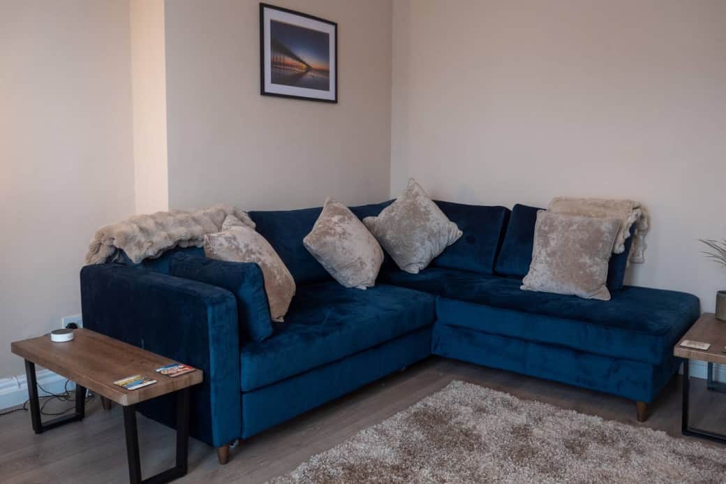 Large living, dining room with smart TV and sofa bed 