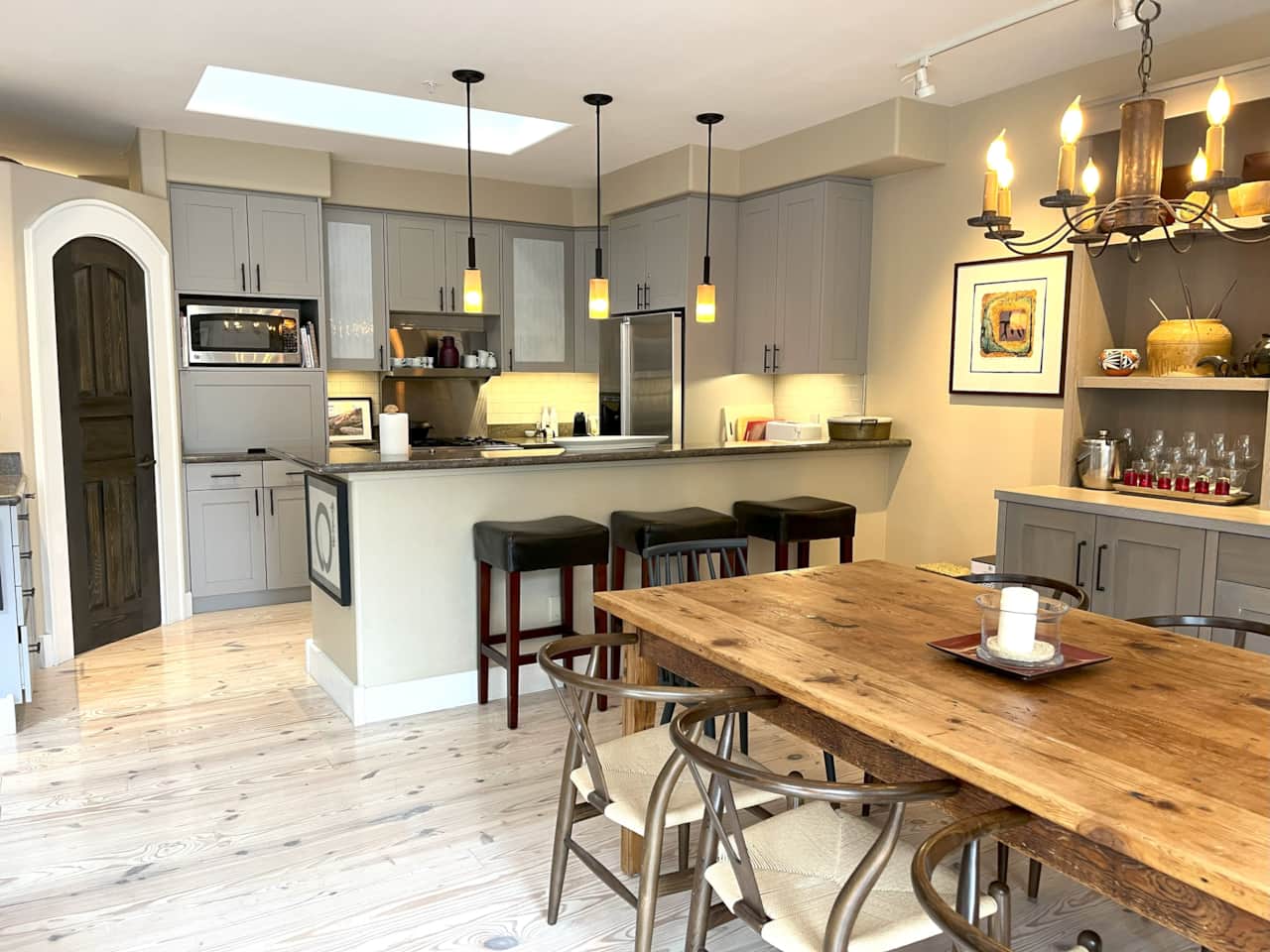 Rustic dining table with additional seating at breakfast bar