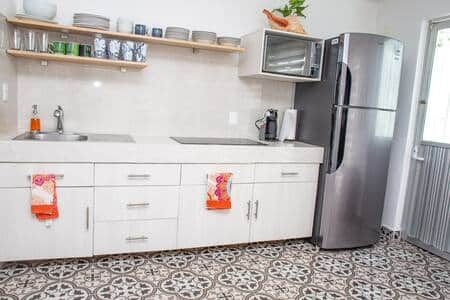 The kitchen is fully stocked for all your cooking needs. The kitchen is fully stocked for all your cooking needs.