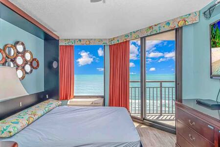 Queen sized Murphy bed in living room with beautiful Direct Oceanfront views!
