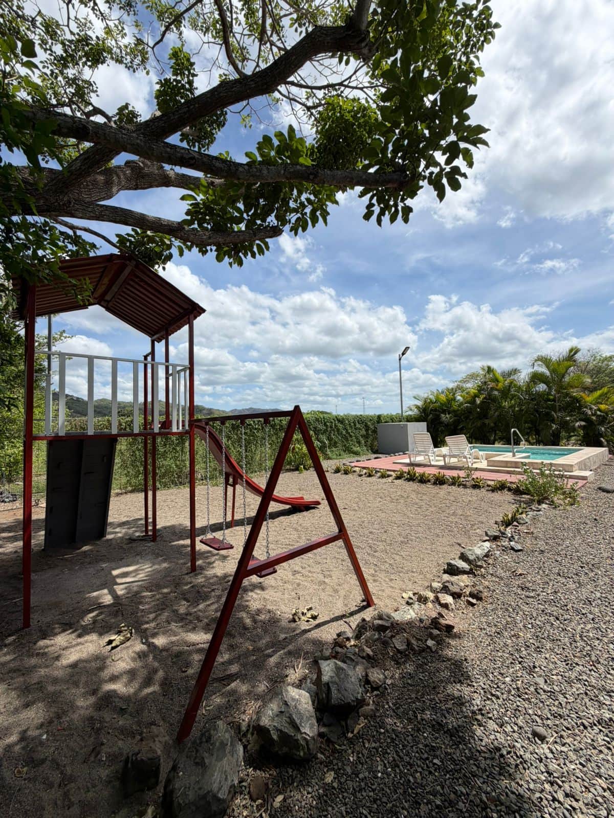 Relax & fun: watch the kids on the swings right from the comfort of your private pool.