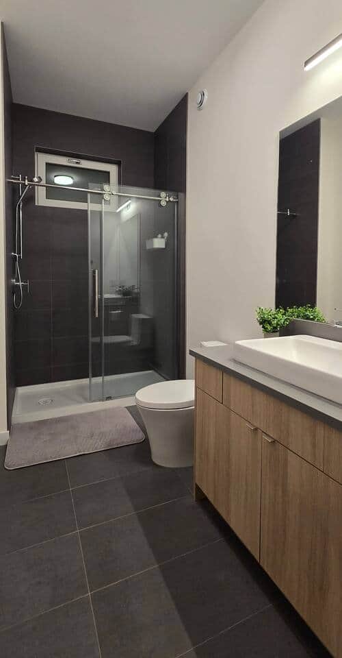Clean modern bathroom with shower.