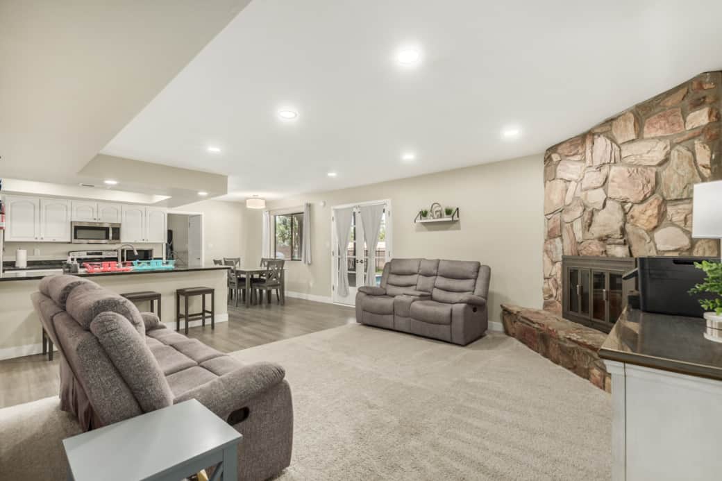 Family room with reclining seats, printer and game cabinet Family room with reclining seats, printer and game cabinet