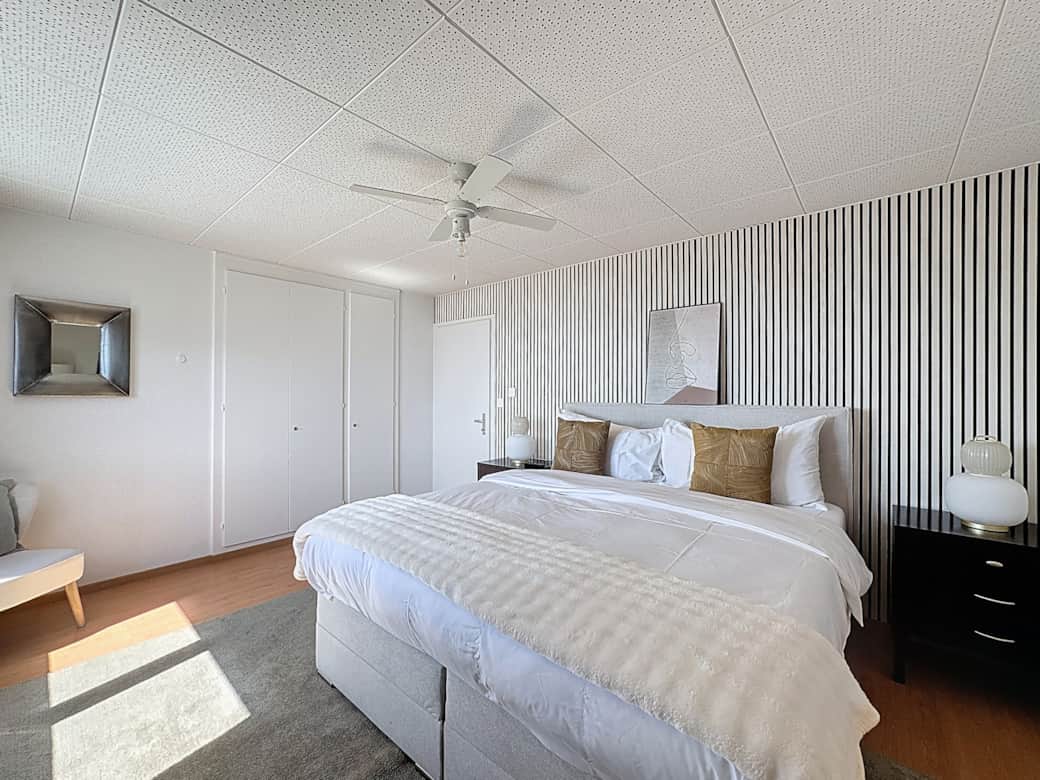 Master bedroom with view of the mountains and Lake Geneva on the 1st floor