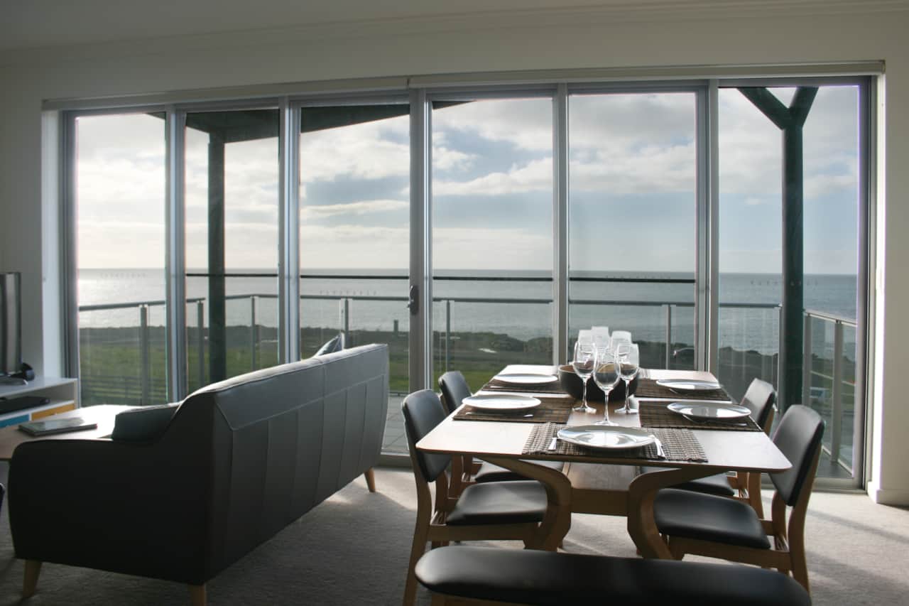 Dining table showing stunning views of the ocean.  Eat meals while enjoying scenery of Penneshaw ocean