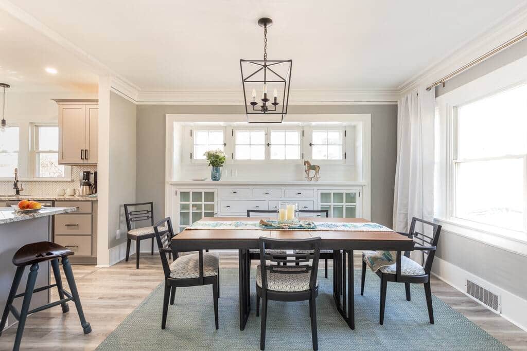 Gather around this inviting dining space that flows seamlessly into the living room.