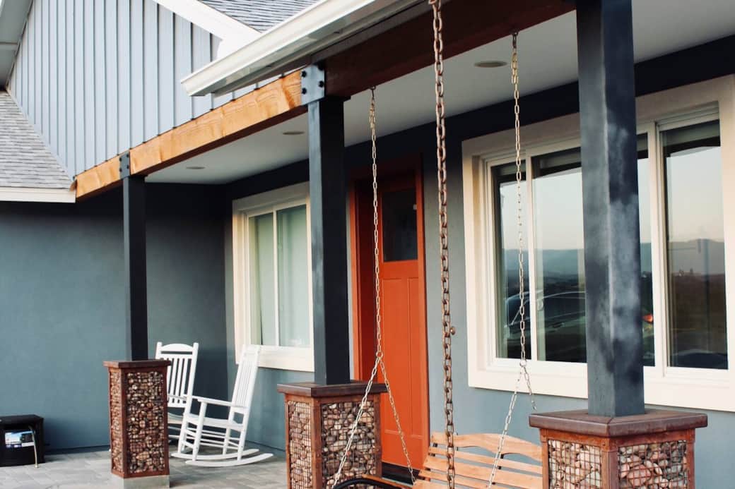 Peaceful front porch with swing and rockers.  Perfect for watching the sunset with a glass of local wine in the evening.