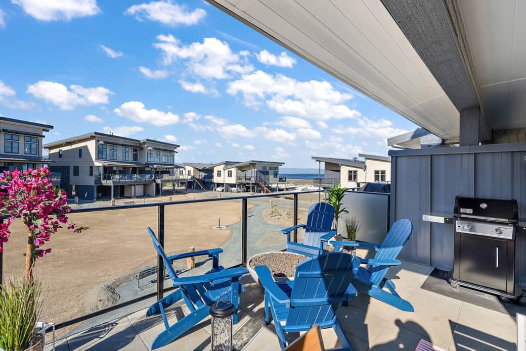 Enjoy dinner on the stylish deck, whether prepared in the kitchen or on the Weber natural gas grill. 

Note: these photos were taken before our green grass grew in!