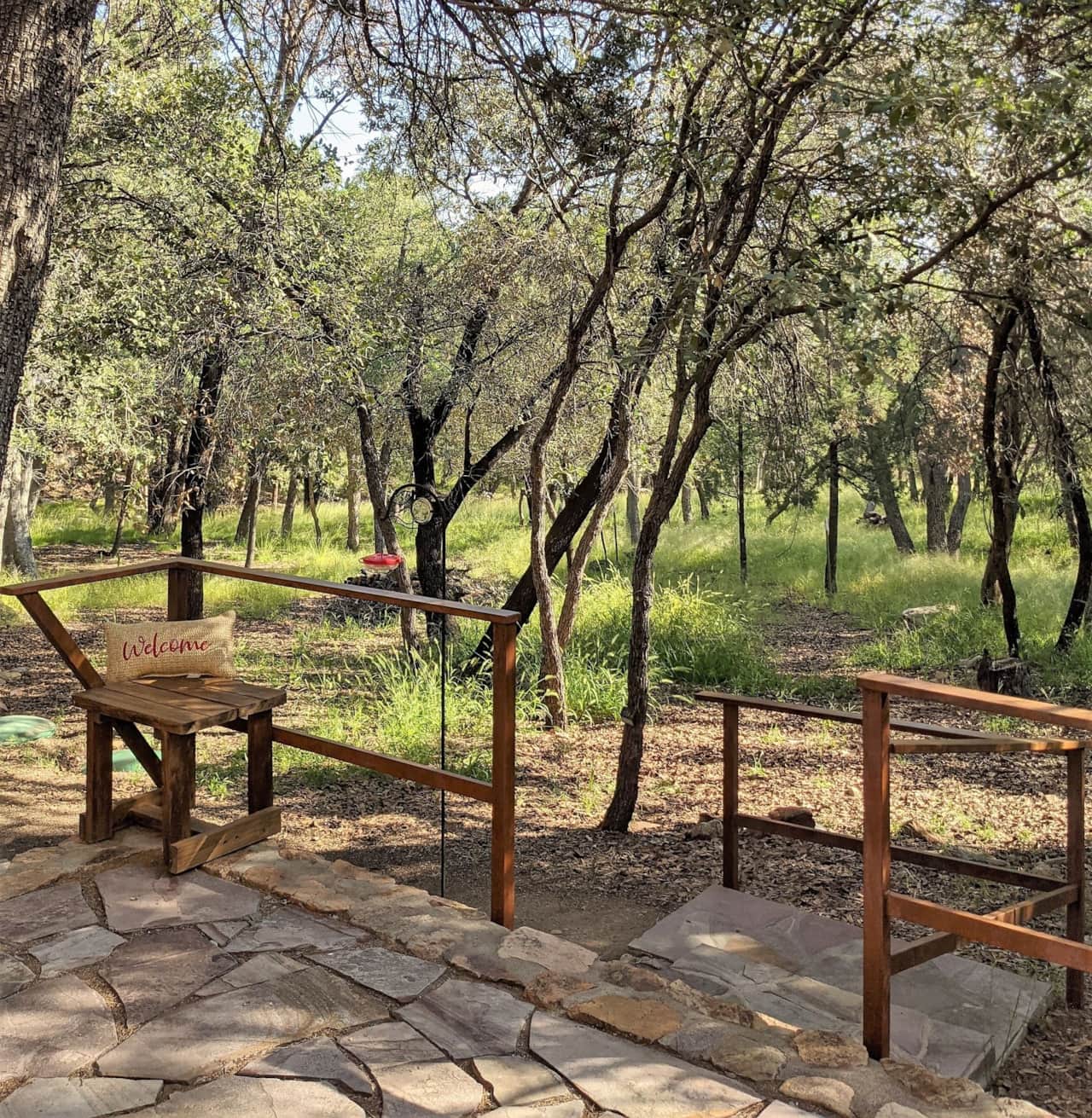 Looking out into the forest of Ramsey Canyon from your private patio at Cowboy Cabin.