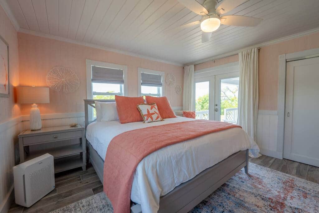 Master bedroom includes King bed with luxury linens land front porch access Master bedroom includes King bed with luxury linens land front porch access