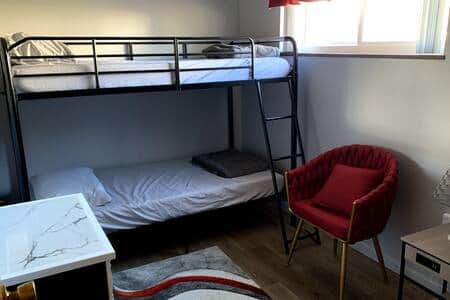 Welcome to the Red Room.  Bunk beds, a closet, and a small dresser provide space for all your stuff.
