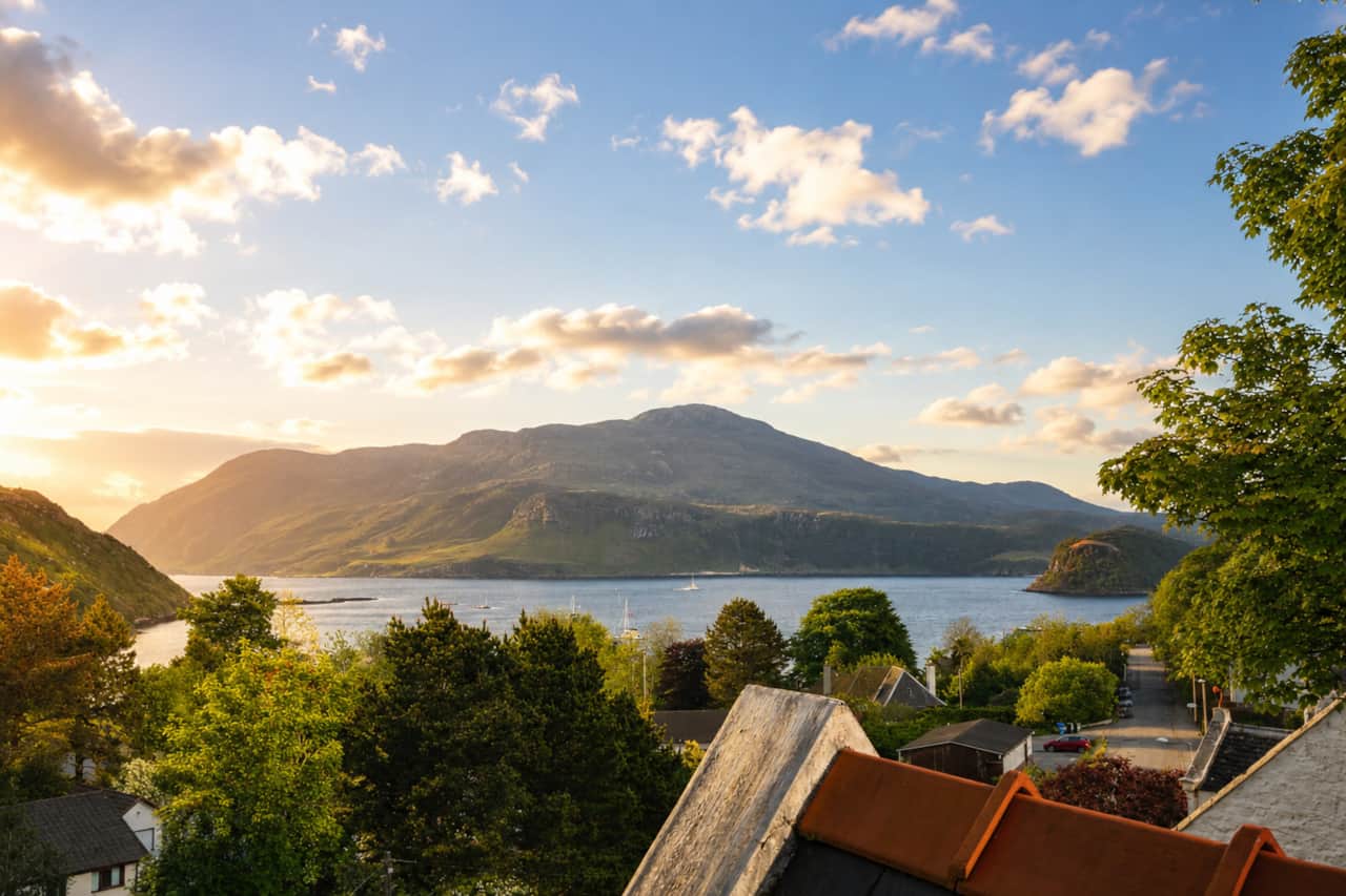 Golden-hour view over Loch Portree and the hills of the Isle of Skye.