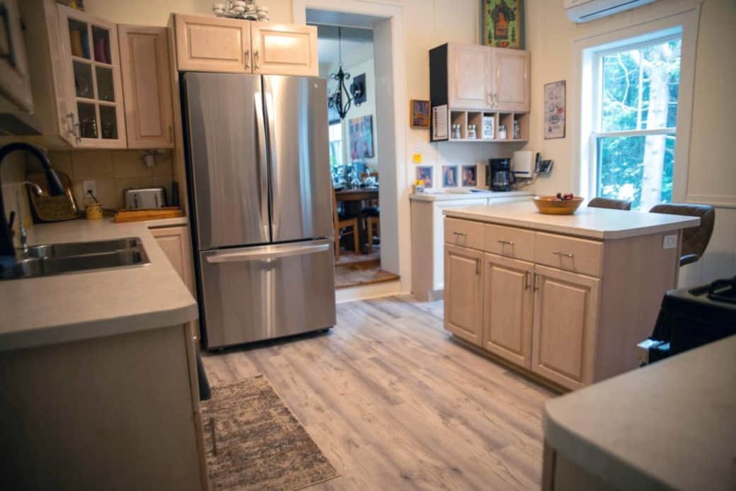 Brand new bright kitchen with new fridge and gas range