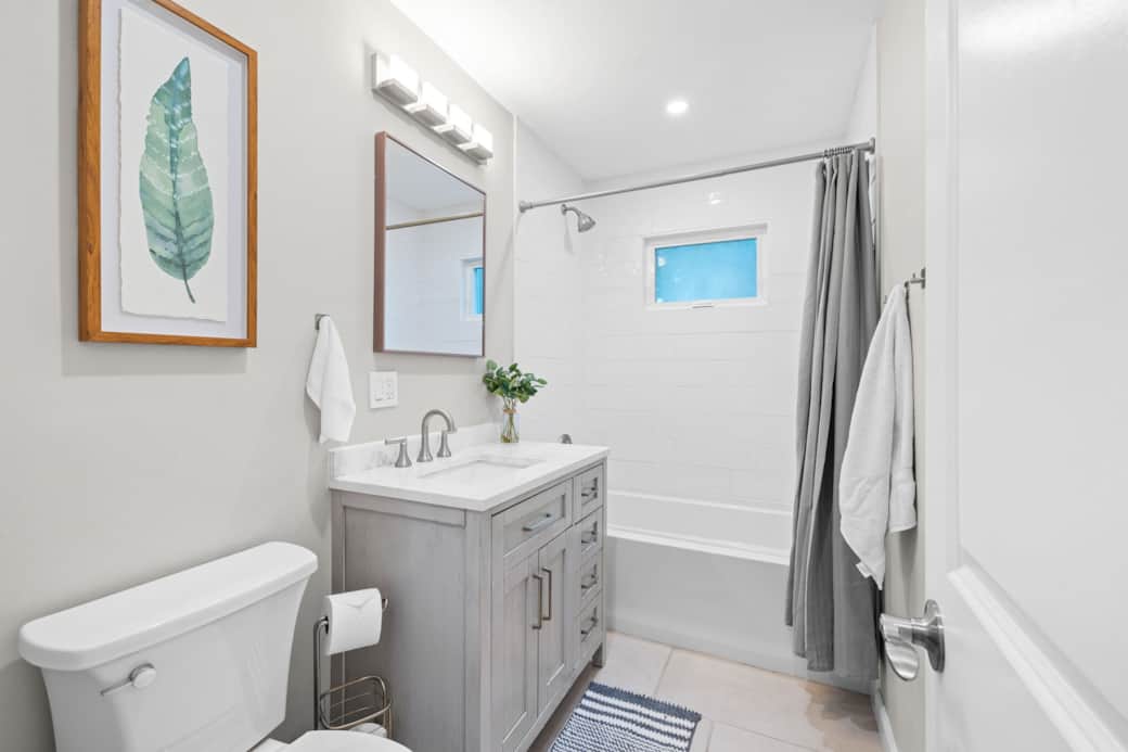 Bright and modern bathroom with plenty of natural light, perfect for getting ready in the mornings.