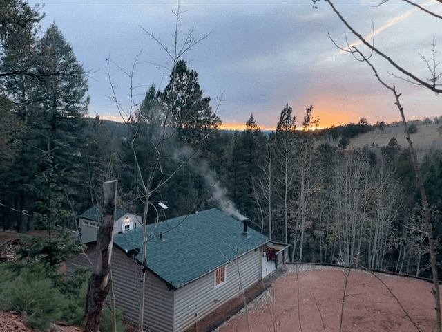 Smoke Lazily Comes Up from Chimney on a Fall Day
